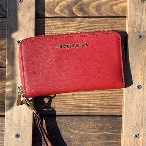 Red Michael Kors Jet Set travel wallet